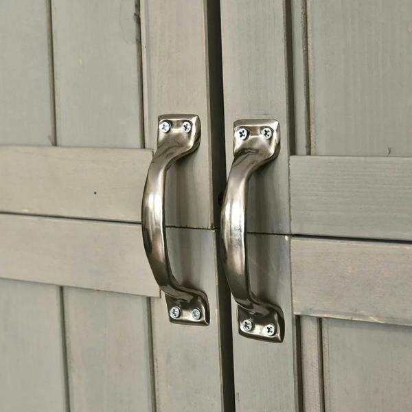 Metal door handle and latch on grey wooden double-door shed