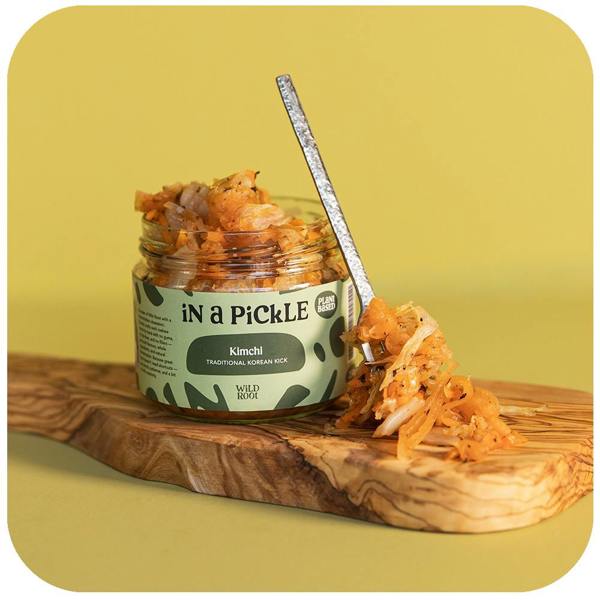 Kimchi jar opened with a spoon