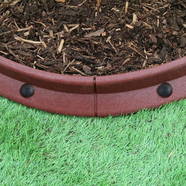 Flexible terracotta lawn edging, 1.2m long, featuring a smooth, curved design with black connectors, set against mulch and grass