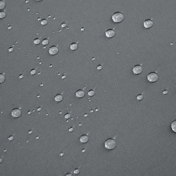 Dark grey woven cushion cover with visible water droplets, water-resistant texture