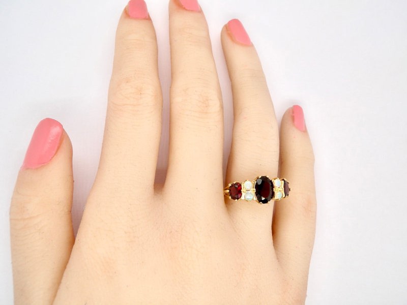 Vintage Tom An 18 carat gold garnet and opal dress ring