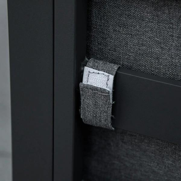 Grey cushion secured with strap on black chair back, close-up