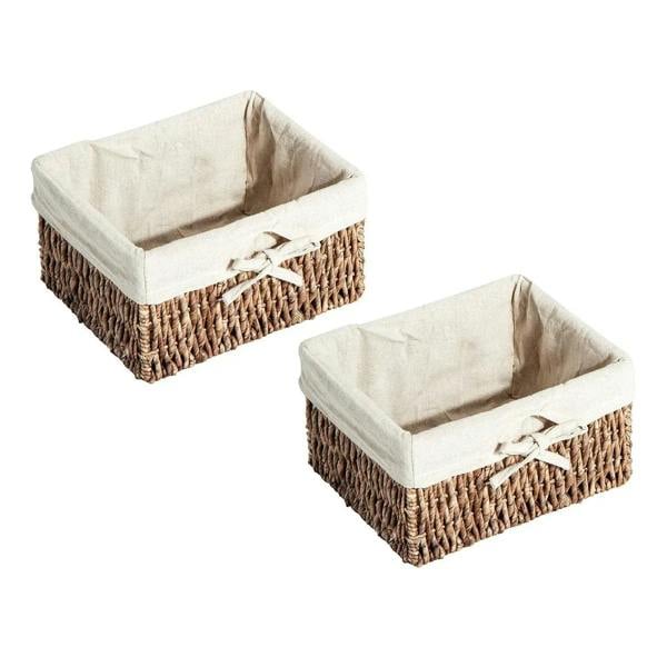 Pair of brown woven storage baskets with white fabric liners and ribbon ties