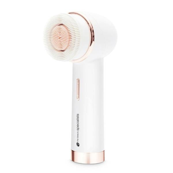 The PURE CLEANSE Deep Cleansing & Exfoliating Facial Brush by Rio the Beauty Specialists in white and rose gold, featuring soft bristles, stands upright against a plain white background.
