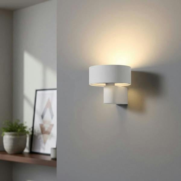 White wall mount interior light on a light coloured wall in a modern home