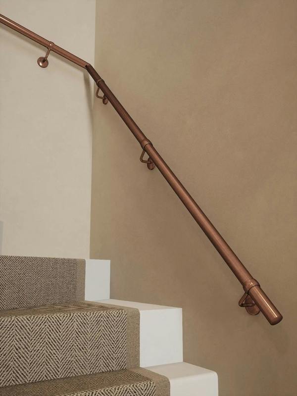 Sambourne Antique Copper Double Winder Handrail showing brackets and elbow