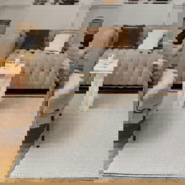 Living Room rug, beige-cream colours, dots, practicality in mind, the rug is anti-allergic.