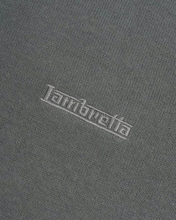 Lambretta Mens Smart Casual Knitted Long Sleeve Tipped Polo, close-up image showing the embroidered Lambretta logo on the grey fabric.
