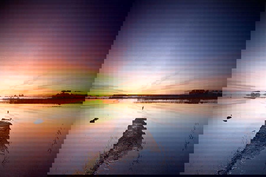 sunrise over the jetty and lake