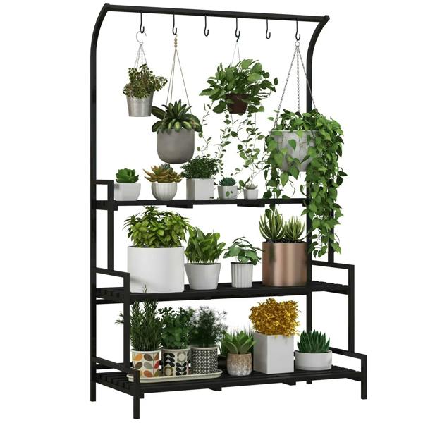 Black 3-tier plant rack with hanging hooks and three shelves, holding potted plants