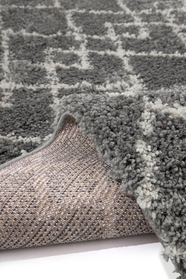 Close-up of a plush grey Moroccan-style rug, showcasing its intricate design and soft texture, ideal for stylish interiors.