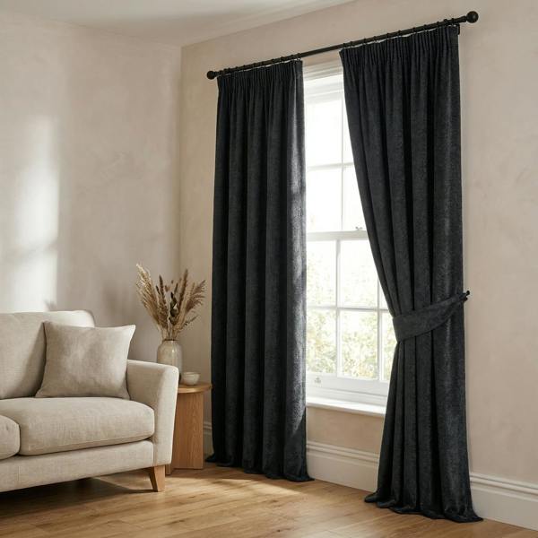 Tuvalu made-to-measure curtains in Graphite, styled in a living room