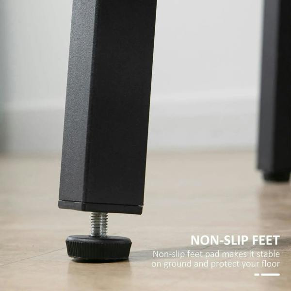 Black steel table leg with non-slip foot pad beneath round tabletop