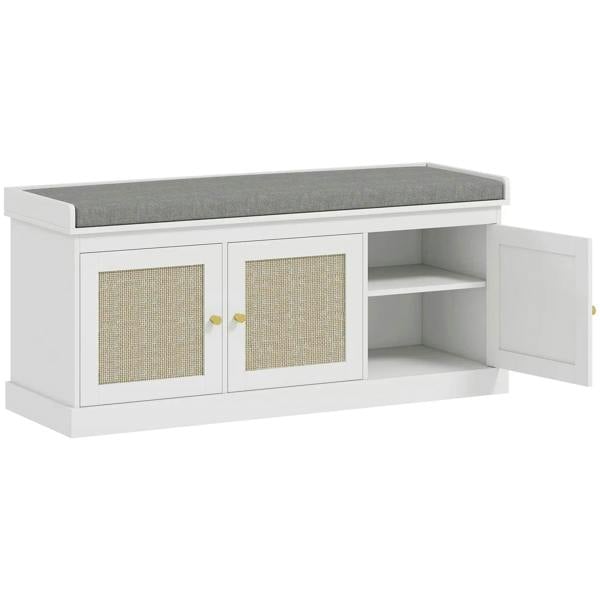 White shoe storage bench with gray upholstered seat and woven rattan cabinet doors