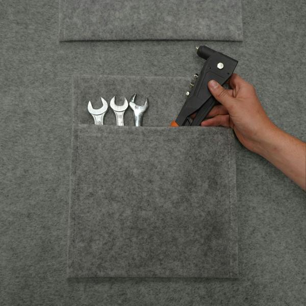 Smoke grey storage pouches made of felt, featuring multiple pockets holding various tools, ideal for organization and storage
