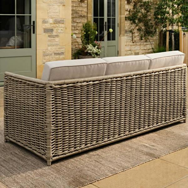 The back view of a 3-seater rattan sofa showing the woven frame.
