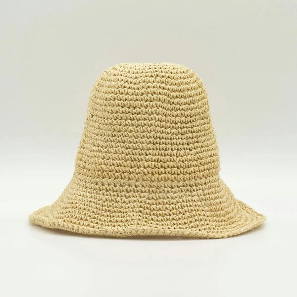 Natural beige straw floppy sun hat with rounded crown and wide brim