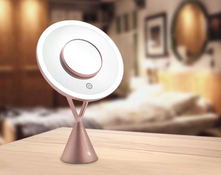 HD illuminated make up mirror with ring light illuminated placed on wooden table with bedroom background