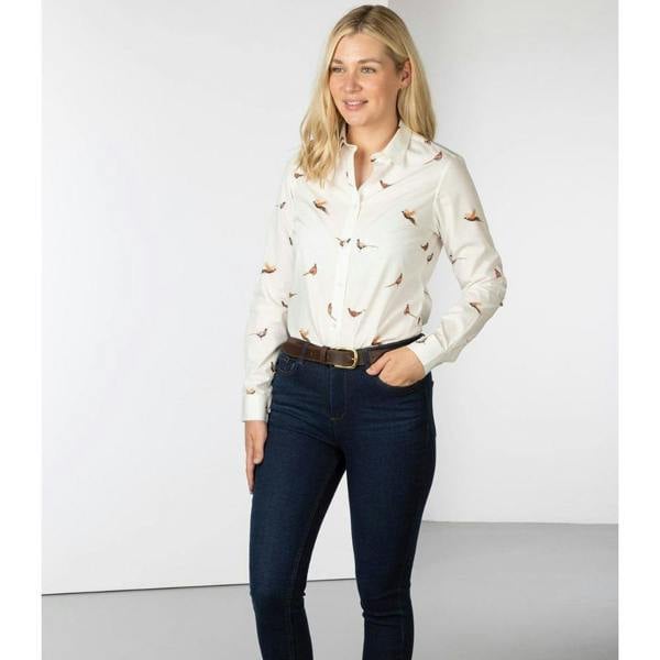 Model wearing the Rydale Wistow Ladies Pheasant Printed Shirt with dark jeans, featuring a breathable cotton fabric, button-up front and classic country style.