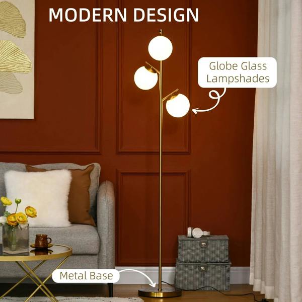 Gold three-light floor lamp with round white globe lampshades and metal base