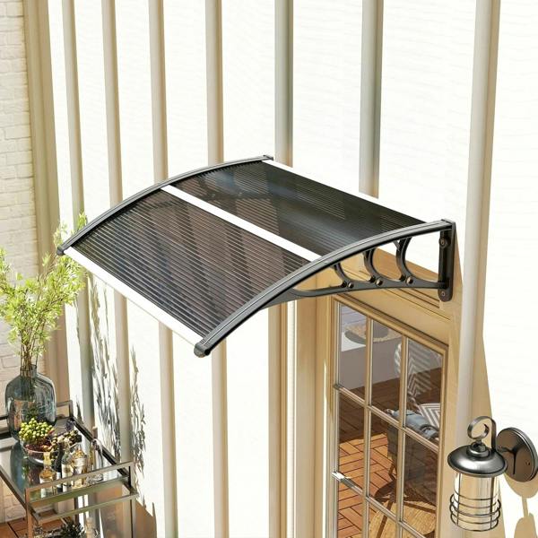 Black door canopy awning with curved translucent panel and wall-mounted support brackets