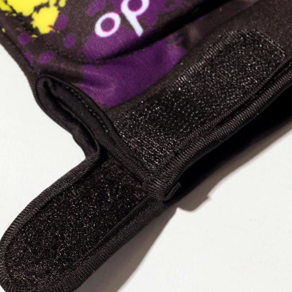 Close-up of black Optimum Fusion half-finger hockey glove Velcro cuff strap with purple splatter print - Optimum