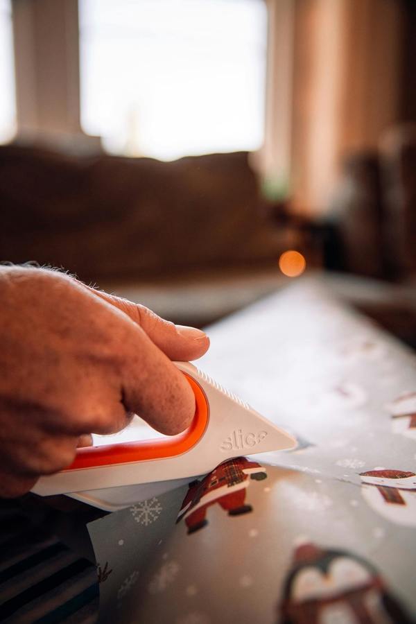 Slice Rotary Scissors In Use on Wrapping Paper - DaltonSafety
