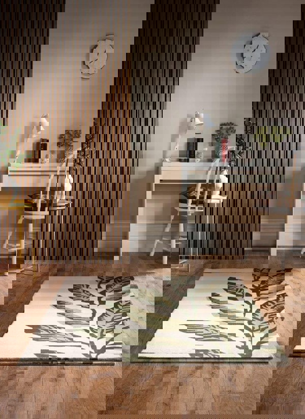 Paradise Leaf hand-tufted wool rug in cream and green, adding natural elegance to a modern living space.