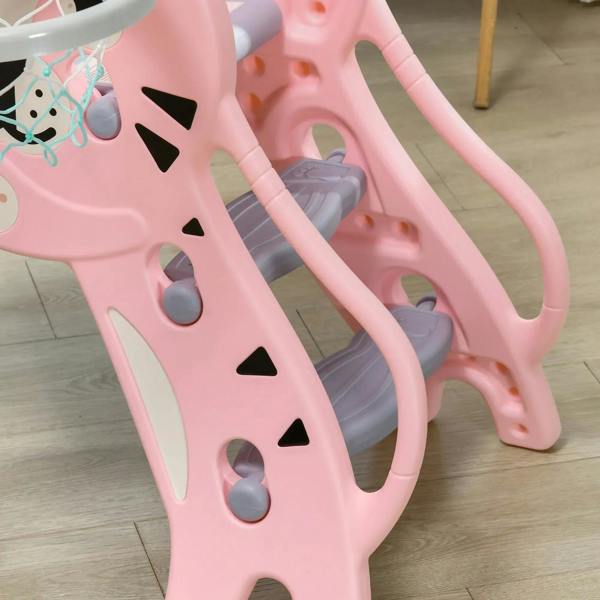 Close-up of pink animal-themed climber base with gray steps and safety hoop
