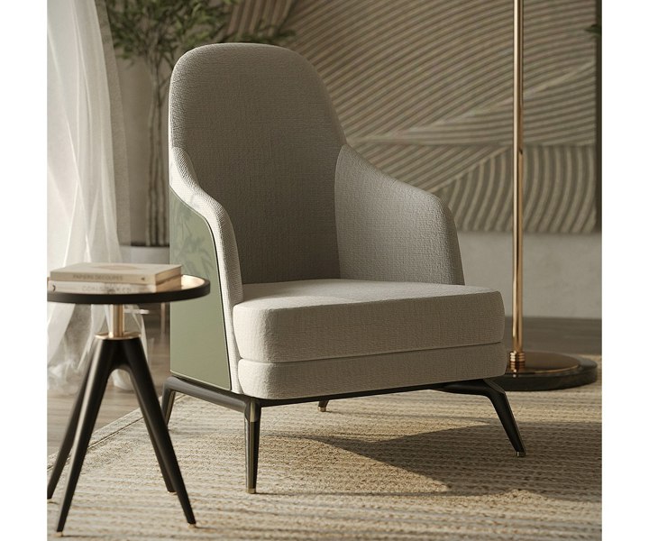Close-up of the Summers armchair with luxurious fabric and oak wood details.