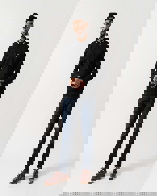 Model wearing BOSS Green Mens Plisy Long Sleeve Polo Shirt in Black 001 - full length