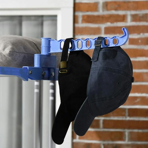 Blue hanging hook bar with clips on a foldable drying rack, close-up.