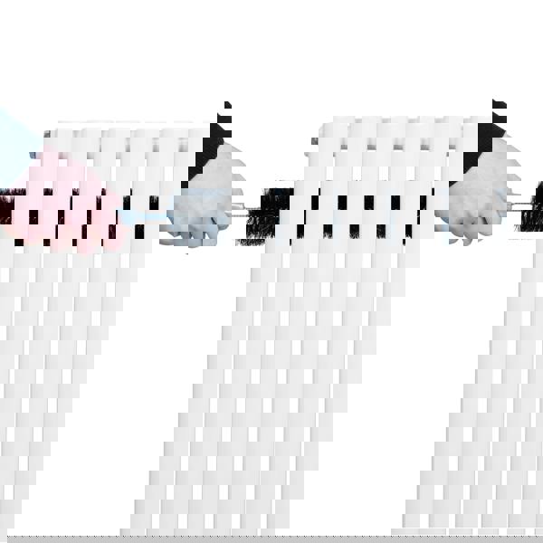 White oval single column radiator being cleaned with a brush, showcasing its smooth surface and sleek design, ideal for modern interiors