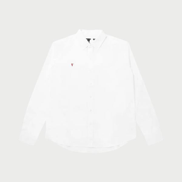 Supplied Fashion crisp white long sleeve button-up shirt with a small red V logo on the chest