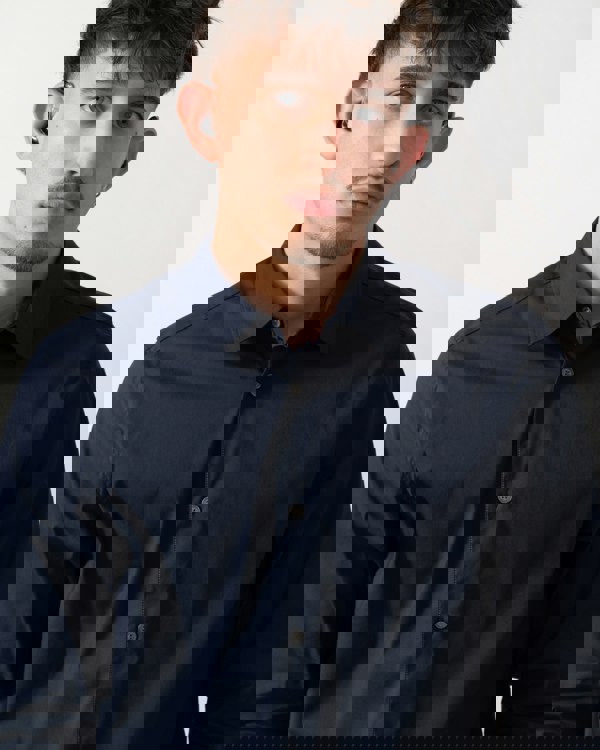 Detail shot of a Model wearing a Ted Baker Baxters Mens Long Sleeve Slim Stretch Shirt in Navy