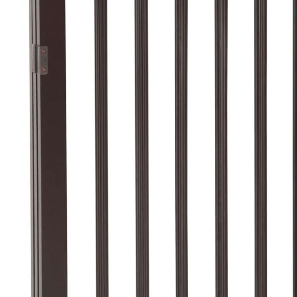 Close-up of brown vertical bars on a foldable dog safety gate
