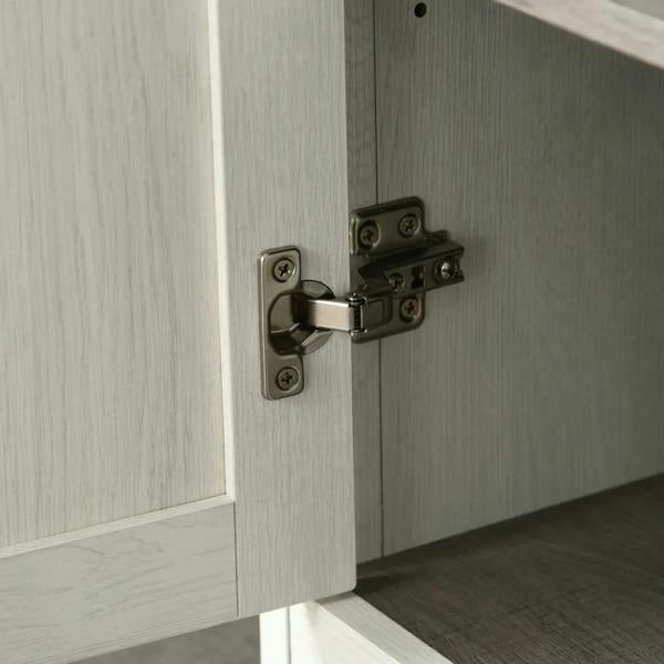Antique white cabinet door with metal hinge and latch hardware on lower panel