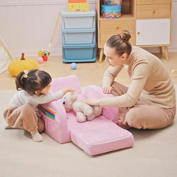 Pink toddler sofa bed with extended bed base, padded seat and supportive backrest
