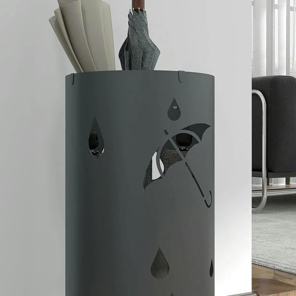 Dark grey umbrella stand with raindrop cutouts and umbrella-handle opening