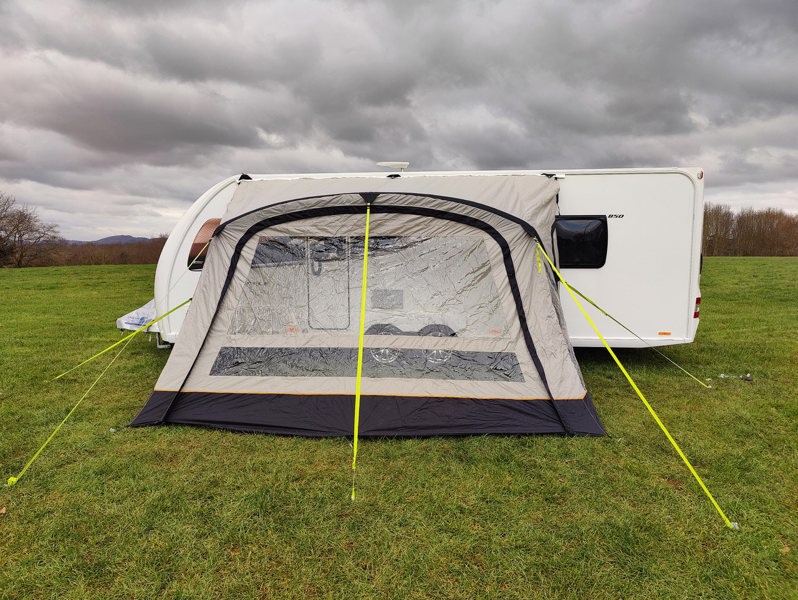 The OLPRO View Lite Breeze 390 Caravan Awning pictured in a Caravan site attached to a caravan.