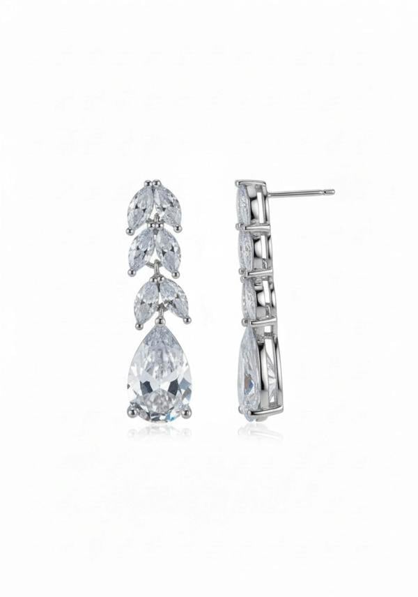 Pair of silver earrings with clear gemstones on a white background