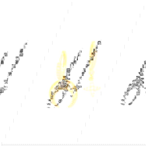 Gold hoop earrings with crescent moon and star designs on a white background