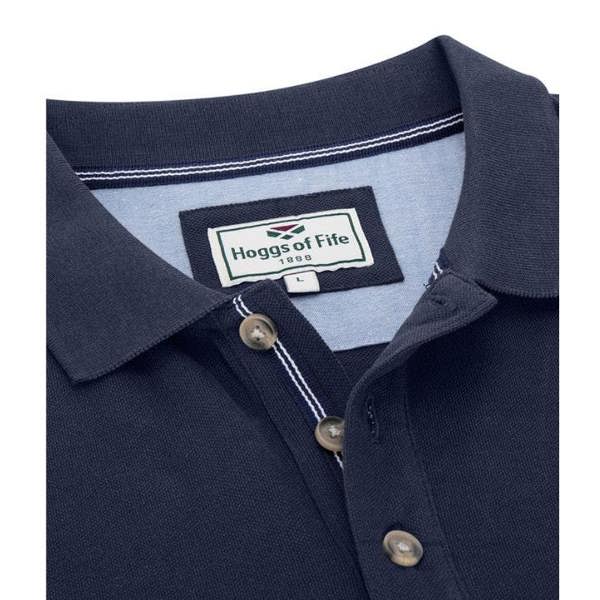 Close-up of Hoggs of Fife Newton polo shirt in navy showing button placket and logo embroidery for countryside casual styling