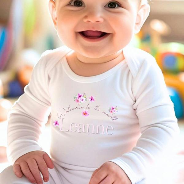 Personalised Pink Flowers Welcome to the World Baby Grow, Vest or Bib with Name