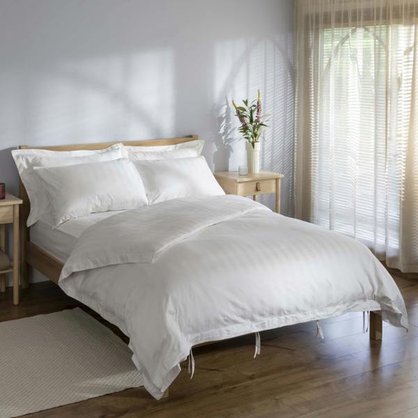 White 400 Thread Count Cotton Stripe 40cm Deep Fitted Sheets styled in a bedroom | Soak and Sleep