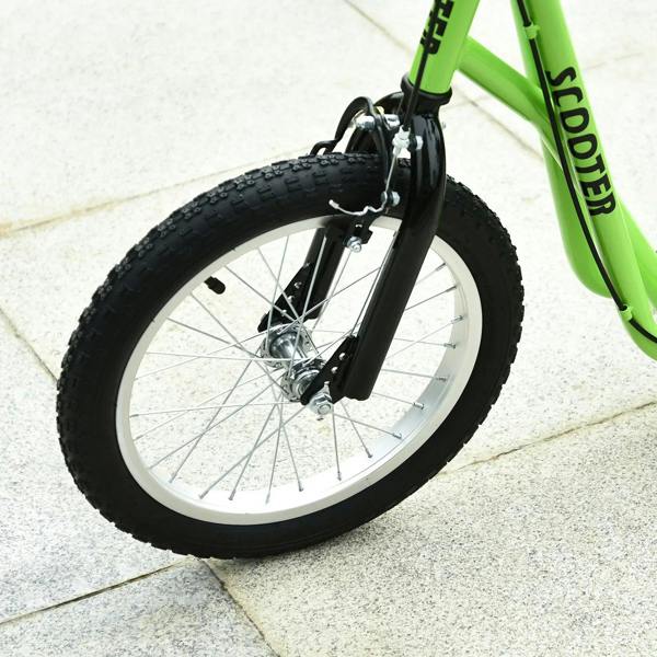 Green kids kick scooter close-up of front wheel, fork, and black brake assembly