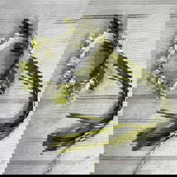 Sage green bun ring with rosettes