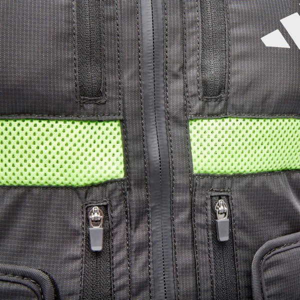 Close-up of a black adidas weighted vest  with green mesh panels and adidas logo