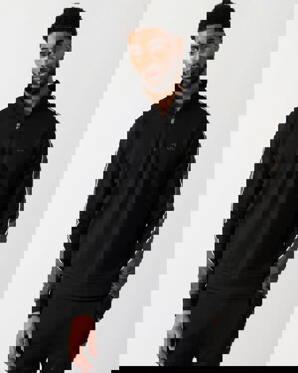 Model wearing a BOSS Orange Mens 1/4 Zip Loungewear Tracksuit Jacket in Black