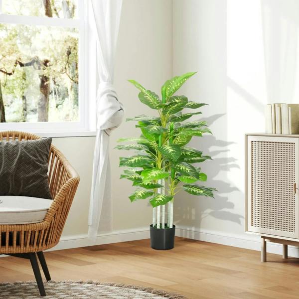 Artificial evergreen tree in black pot with glossy green leaves and stems